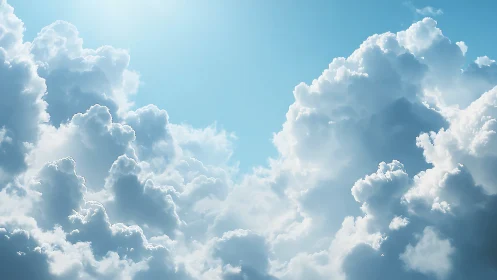 Sunlit cumulus clouds rise softly into a tranquil blue sky