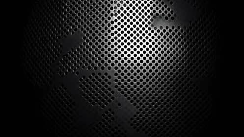 Curved perforated metal grille under focused white light.