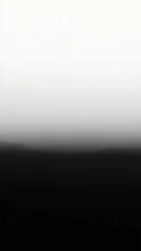 Monochrome vertical gradient field with soft atmospheric horizon band