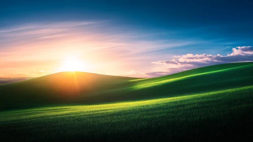 Sunrise light sweeps over rolling green hills and sky