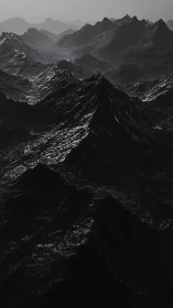 Monochrome mountainous terrain under diffuse light conditions.