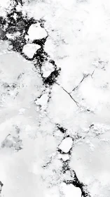 Overhead satellite view of fragmented sea ice and dark leads