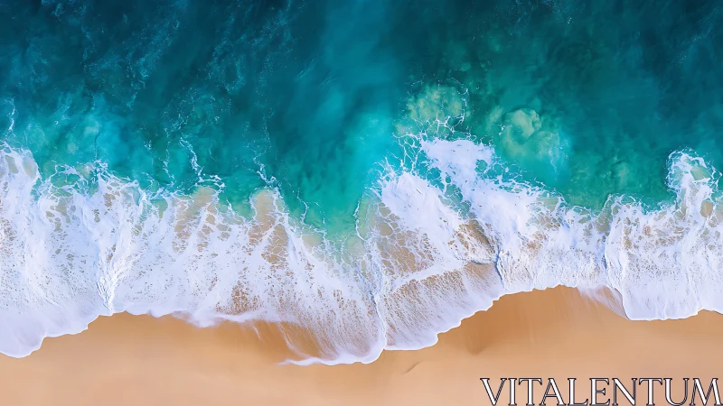Top view of turquoise ocean surf on smooth sandy shore.