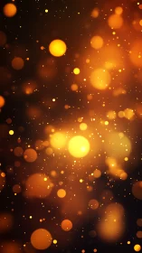 Golden bokeh lights on dark background for warm glow visuals.