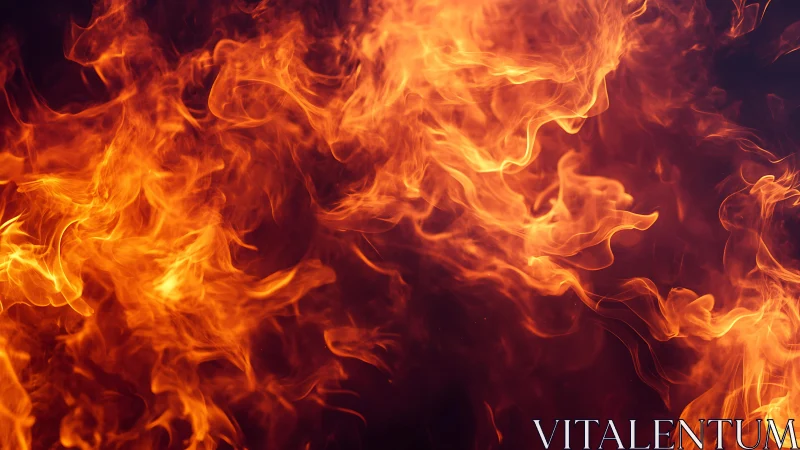 Intense orange fire flames on dark background, dramatic close-up.