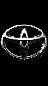 Chrome oval emblem gleams like a polished night mirror.