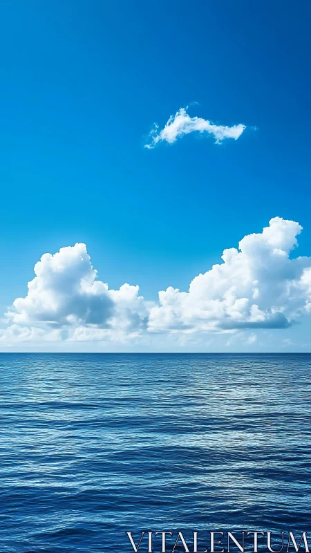 Open ocean horizon under cumulus clouds in midday light