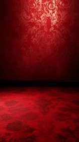 Rich red damask wall and floor glow in dramatic light.