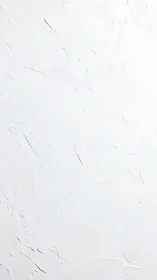 Textured white plaster wall surface with subtle relief patterns.