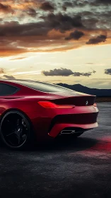 Crimson coupe prowls dusk highways beneath ember clouds.