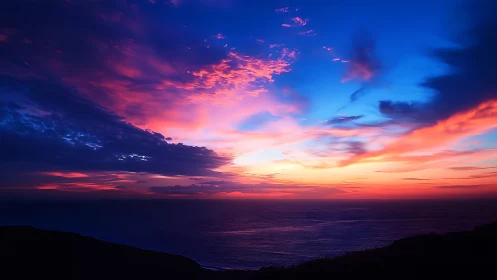 Vivid maritime sunset sky renders stratified chromatic cloud bands