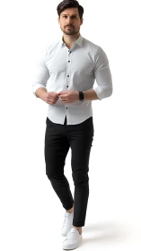 Modern man models slim white shirt and black chinos.