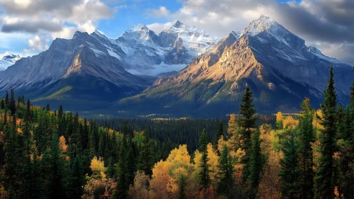 Mountain range above dense autumn forest under clouds.