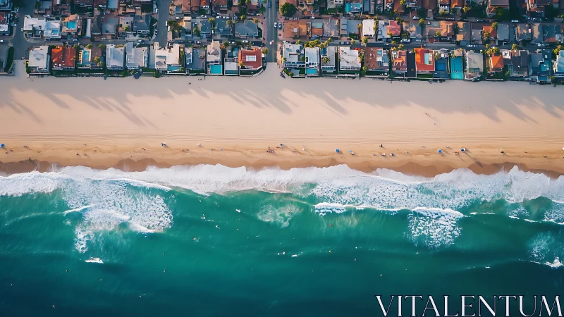 Aerial coastal housing grid aligned with wide sandy shoreline