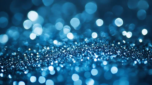 Blue Glitter Abstract Background with Sparkling Bokeh Lights.