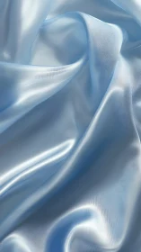 Soft blue satin folds glow gently with serene, fluid light