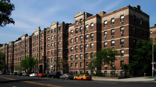 Early 20th‑century brick apartment frontage with axial symmetry.