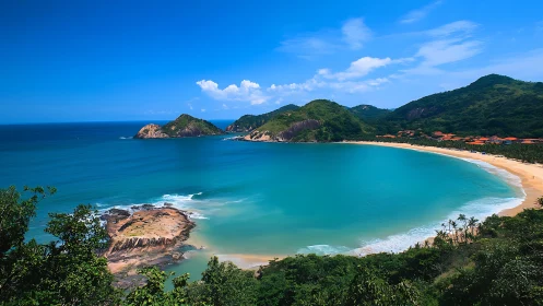 Tropical bay with turquoise waters and forested headlands