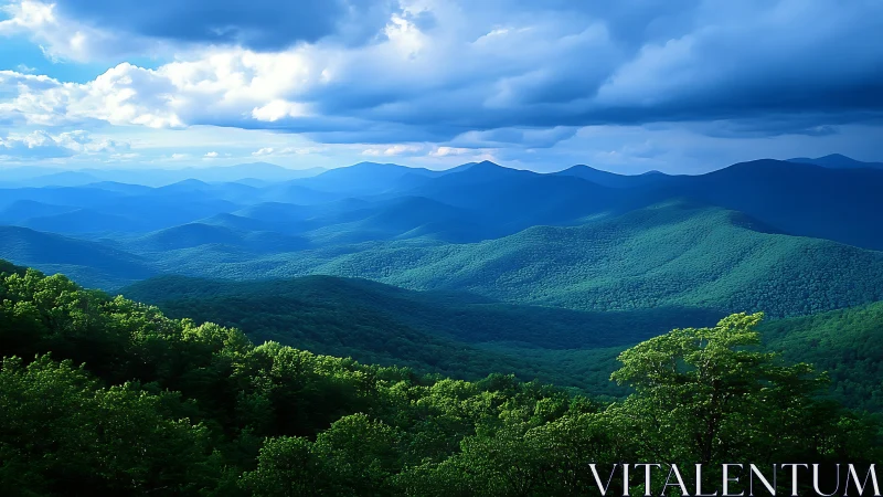 Layered green mountain ridges under heavy blue clouds.
