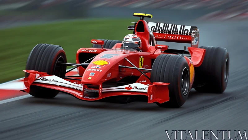 Red Formula 1 car on racing circuit track in motion.