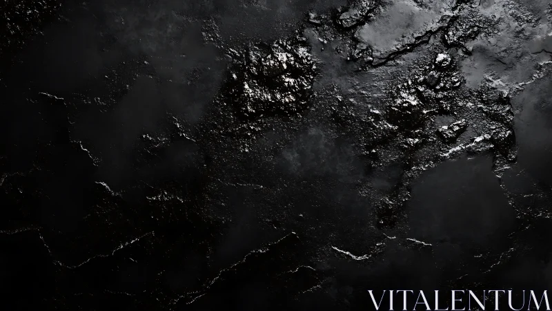 Dark textured black surface with glossy rough patches.