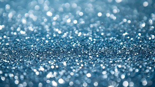 Shimmering blue glitter sparkles in a dreamy soft bokeh haze
