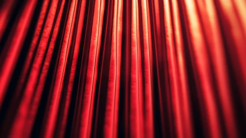 Cinematic close-up of illuminated red theater curtains in bokeh