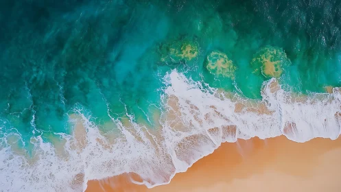 Overhead view shows breaking waves along uniform sandy coast
