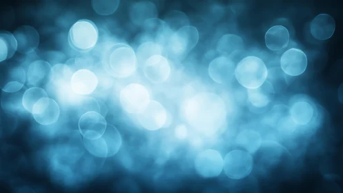 Dreamy Blue Bokeh Light Abstract Background in Soft Focus.