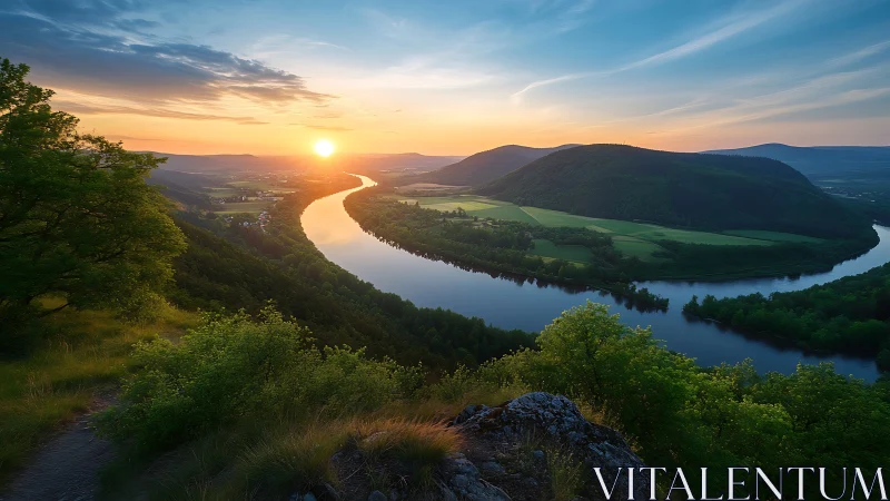 Golden river sunset over peaceful green valley view.