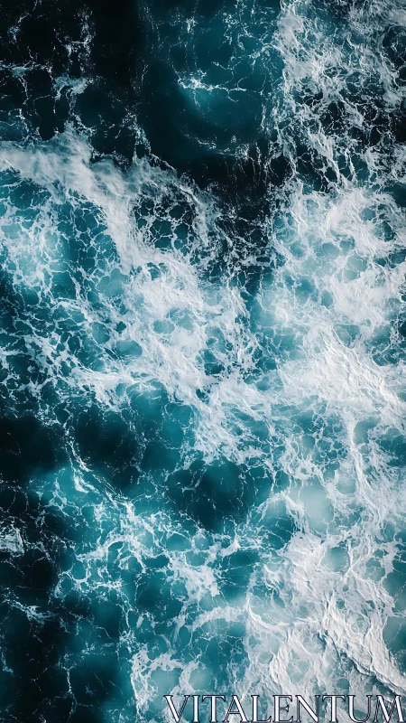 Turbulent teal ocean surface shows high-contrast foam patterns