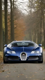 Midnight blue hypercar prowls a quiet autumn forest lane.