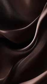 Silken chocolate currents fold into a quiet metallic tide