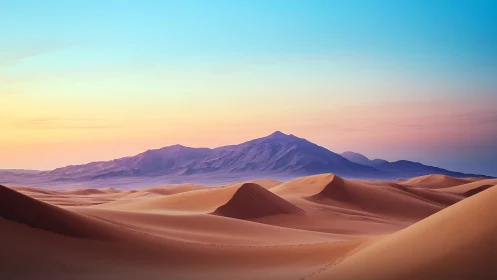 Sunlit sand dunes under pastel desert mountains horizon.