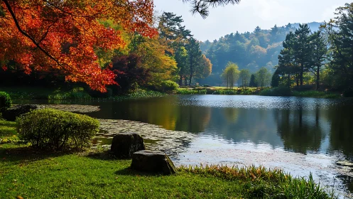 Calm forest lake framed by red autumn foliage and pines.