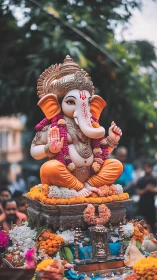 Gentle Ganesha rides a marigold tide through city prayers.