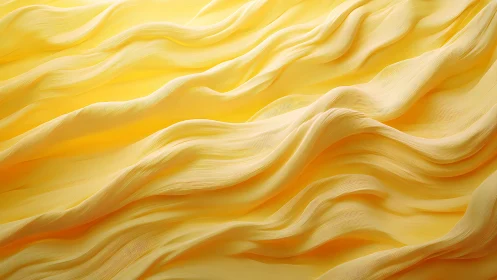 Yellow flowing fabric waves in soft layered folds background.
