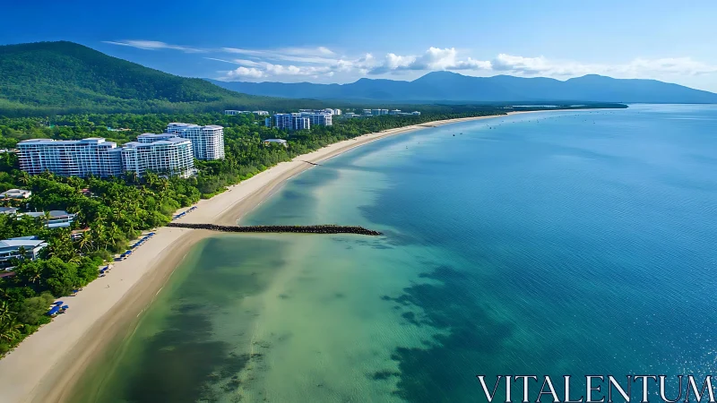 Sweeping tropical shoreline with resort complexes and curved breakwater