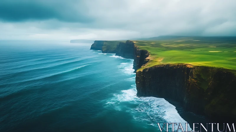 Coastal sea cliffs with green plateau under overcast sky.