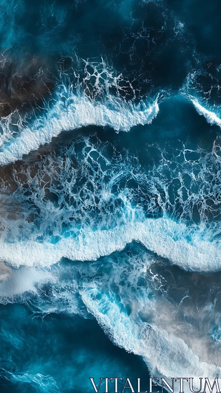 Top view of crashing ocean waves in deep blue water.