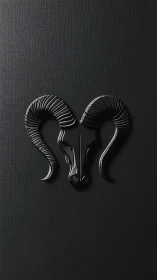 Sleek black ram emblem with sculpted horns on charcoal wall.
