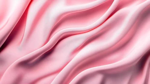 Soft pink fabric folds with smooth flowing surface texture.