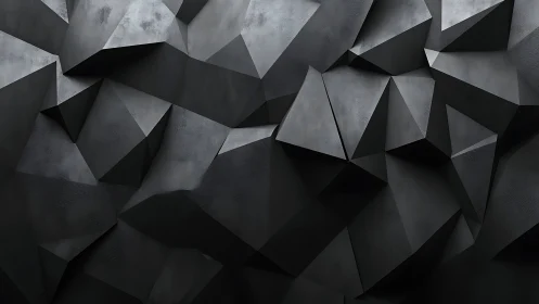 Angular graphite polyhedral relief forms a faceted shadow field