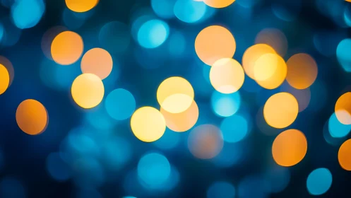 Abstract bokeh background with blue and orange glowing circles.