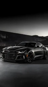 Matte-black performance coupe in low-key automotive studio lighting.