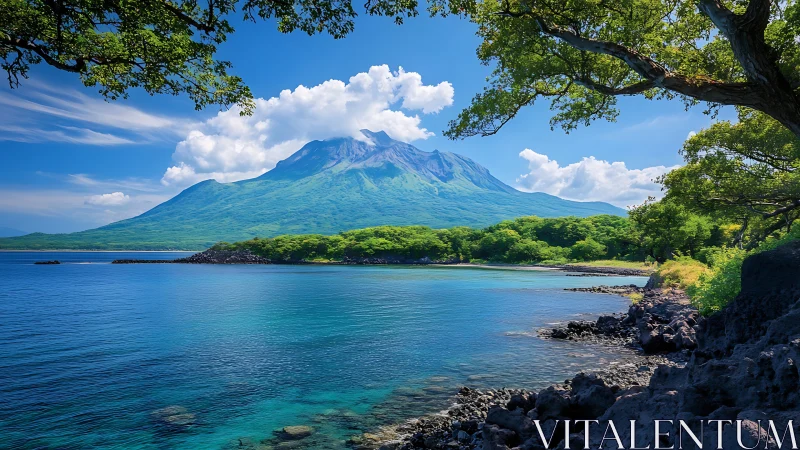 Majestic Volcano Crowned in Clouds Above Turquoise Waters.