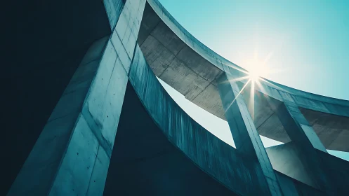Curved concrete overpass catches hard sunlight against sky