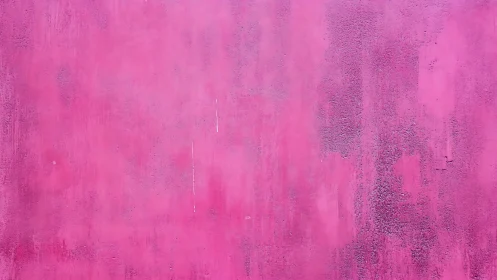 Pink painted wall surface shows subtle texture variations