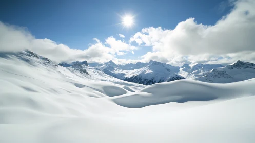 Sunlit snow dunes cradled by quiet winter mountains.