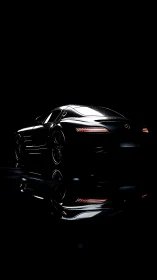 Sleek black sports car emerges from dramatic studio shadows